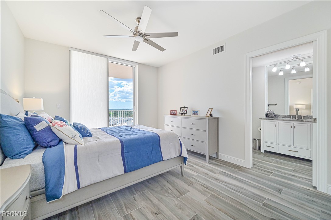 2104 West First Street, Unit 1701 Fort Myers, FL 33901 - Photo 15 of 48 a living room with a bed furniture and a window