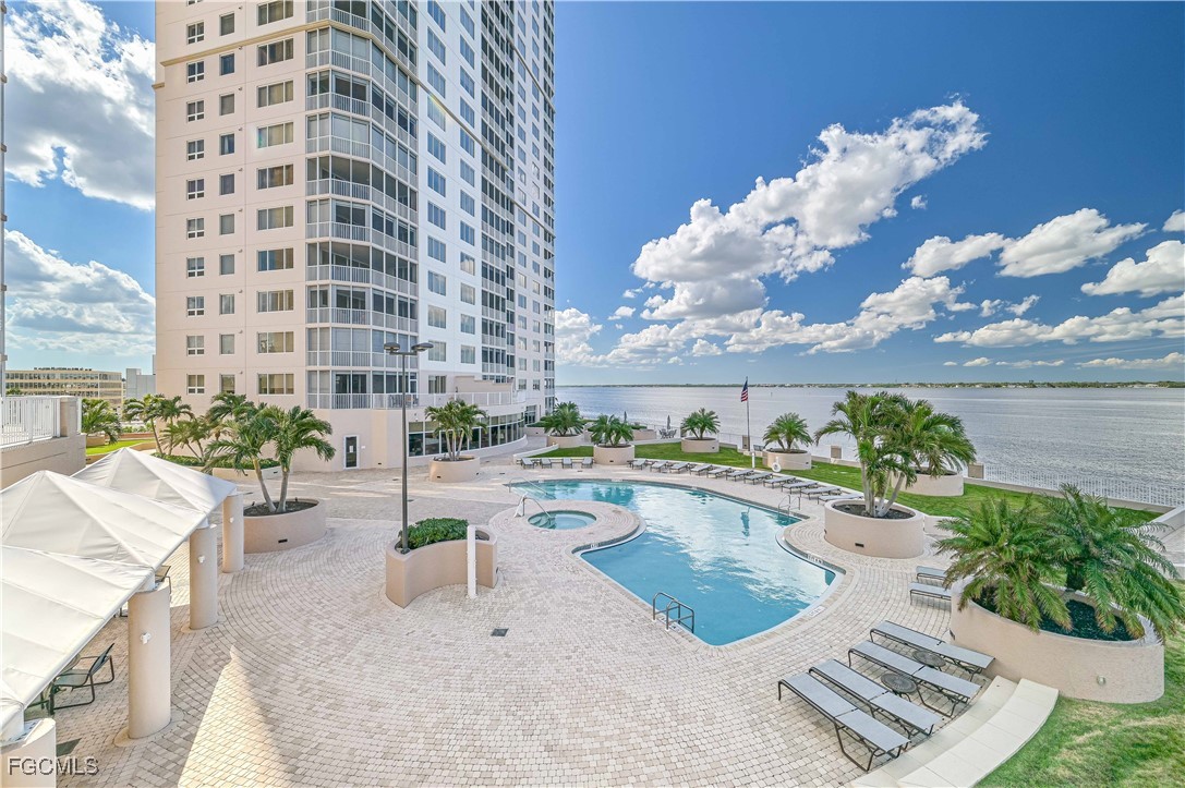 2104 West First Street, Unit 1701 Fort Myers, FL 33901 - Photo 23 of 48 a view of a swimming pool with outdoor seating