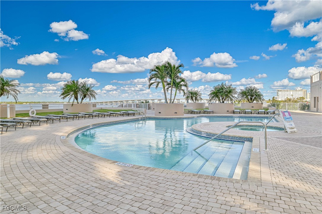 2104 West First Street, Unit 1701 Fort Myers, FL 33901 - Photo 24 of 48 a view of a swimming pool with a patio