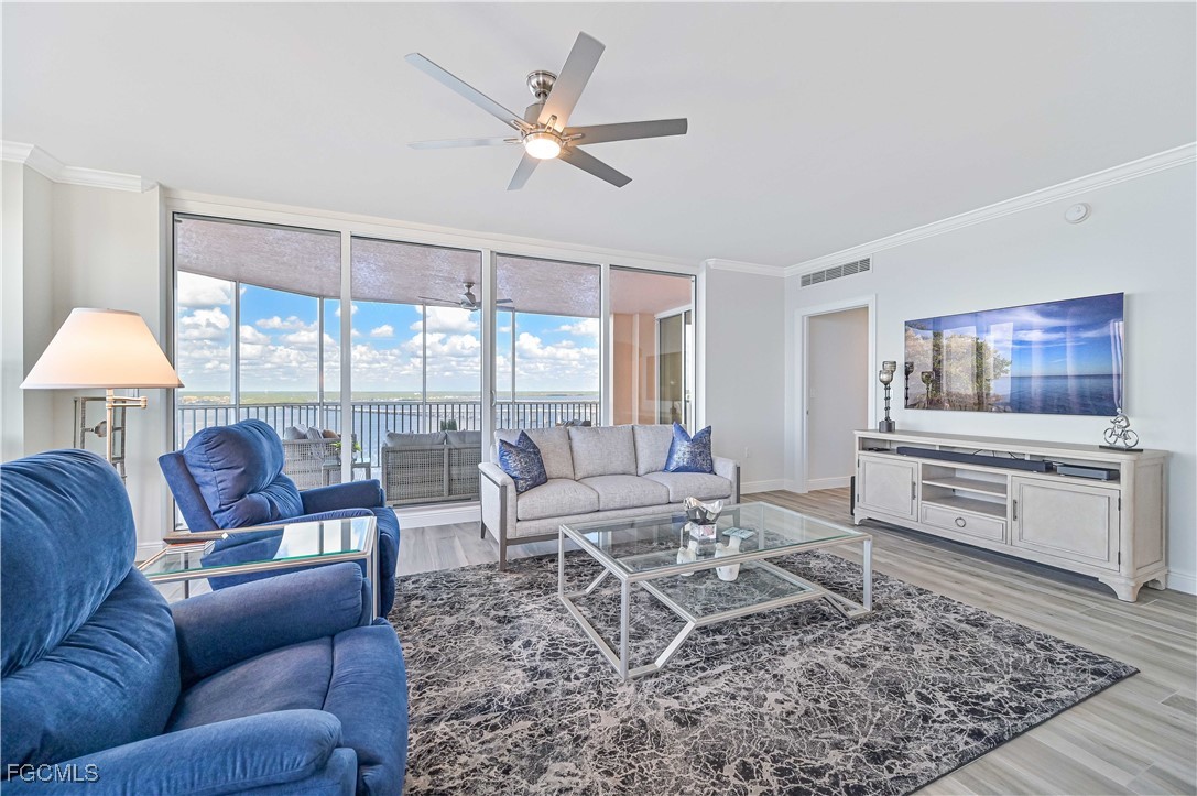 2104 West First Street, Unit 1701 Fort Myers, FL 33901 - Photo 26 of 48 a living room with furniture and a flat screen tv