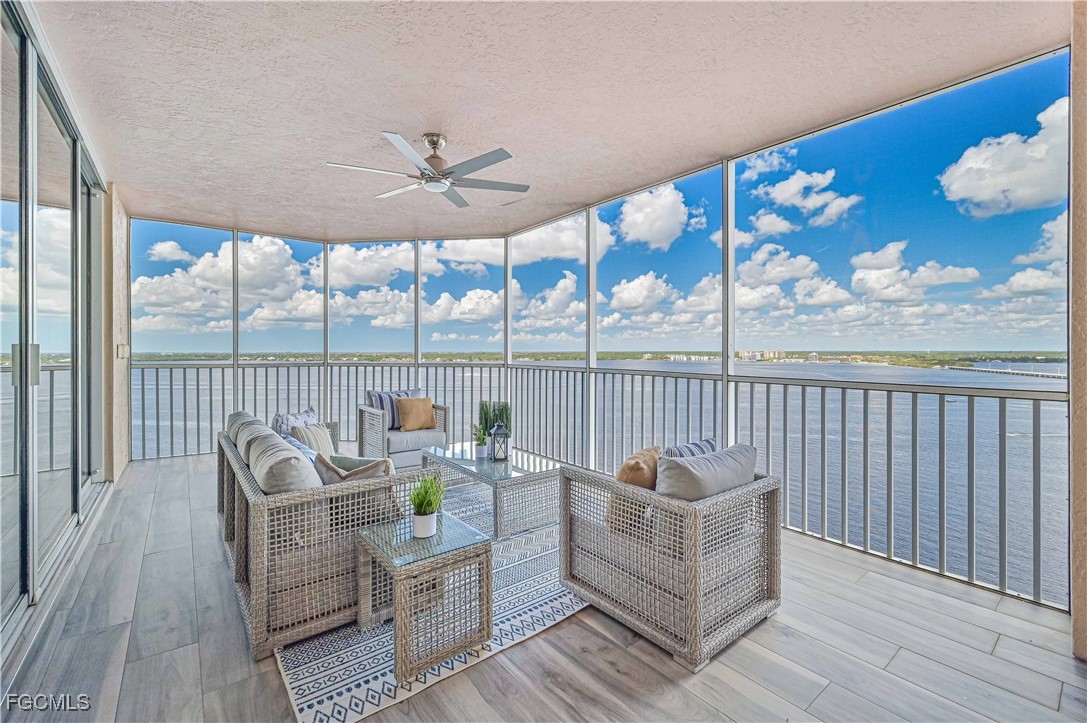 2104 West First Street, Unit 1701 Fort Myers, FL 33901 - Photo 8 of 48 a living room with furniture and a large window