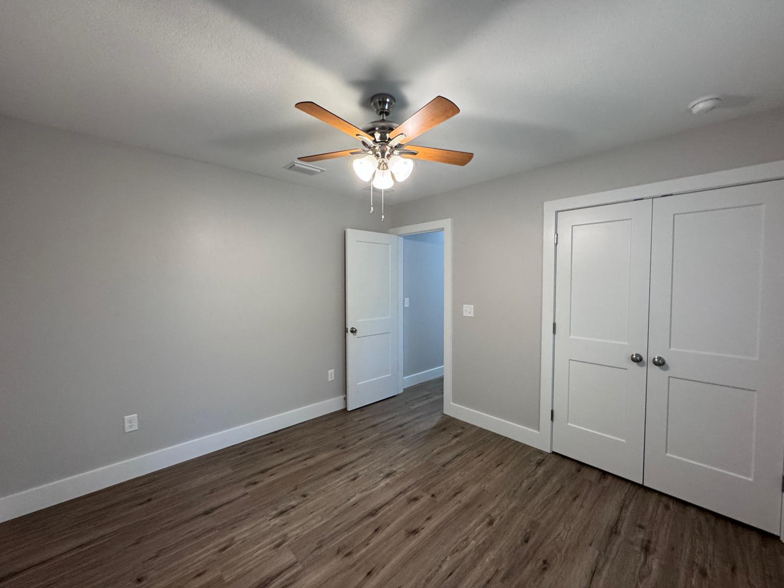 1787 Dads Road Baker, FL 32531 - Photo 16 of 20 wooden floor in an empty room