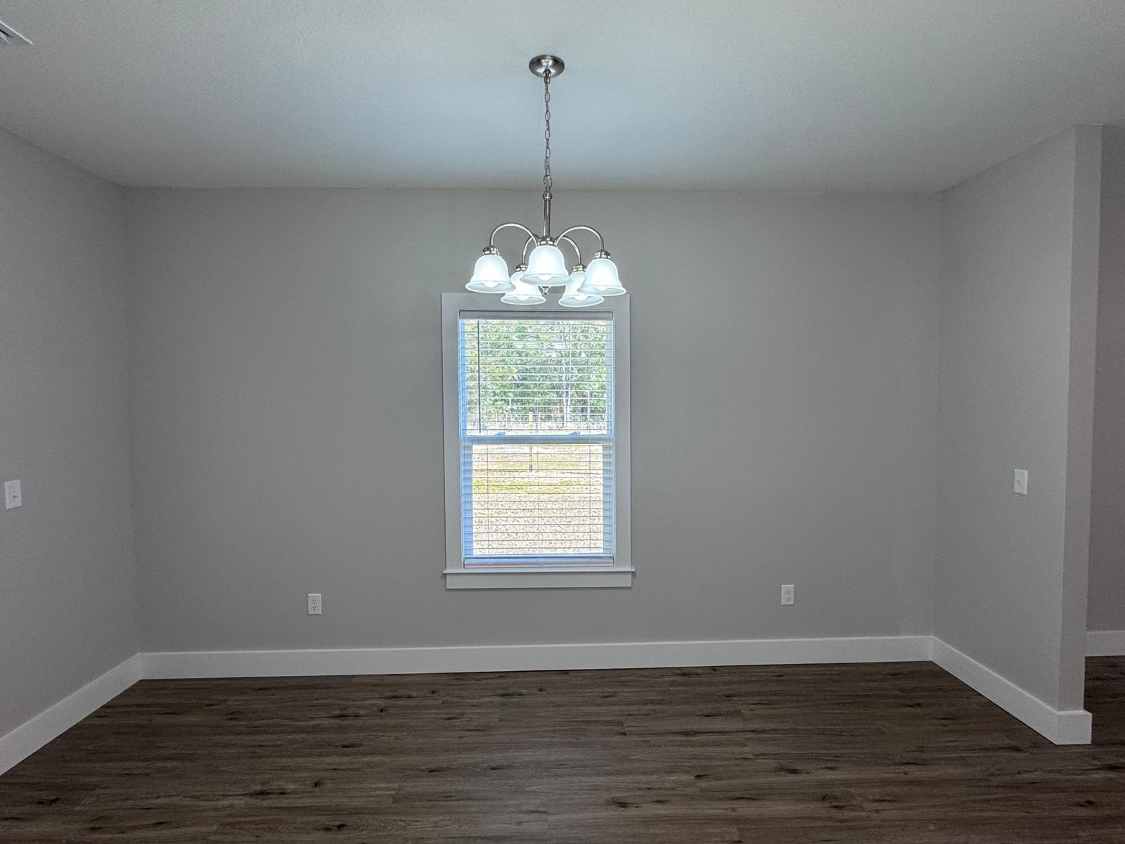 1787 Dads Road Baker, FL 32531 - Photo 7 of 20 a view of a room with wooden floor cabinets and a window