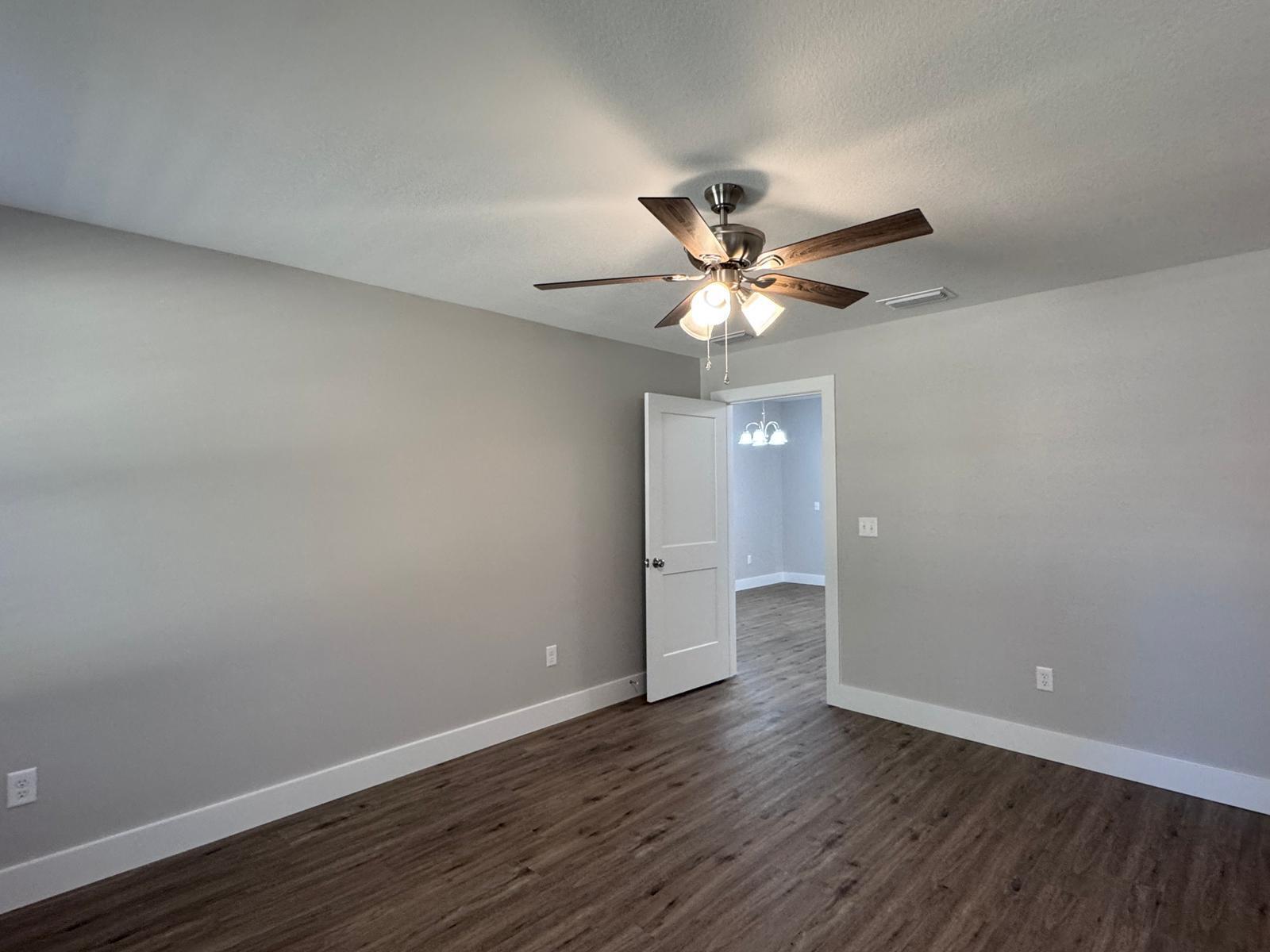 1787 Dads Road Baker, FL 32531 - Photo 8 of 20 a view of an empty room with wooden floor