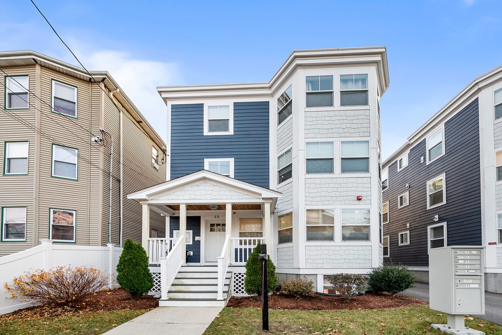 13 Ruthven Street, Unit 1 Boston, MA 02121 - Photo 1 of 35 a front view of a house with a yard