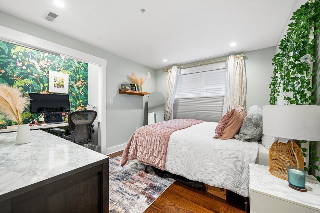 13 Ruthven Street, Unit 1 Boston, MA 02121 - Photo 19 of 35 a bedroom with a bed and large windows