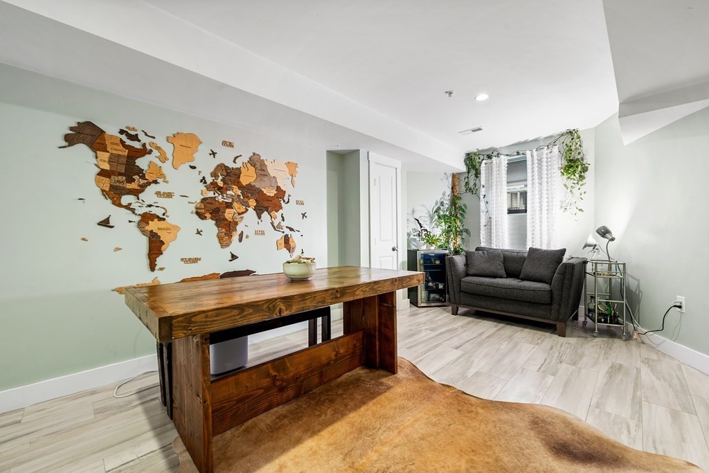 13 Ruthven Street, Unit 1 Boston, MA 02121 - Photo 25 of 35 a living room with furniture and wooden floor