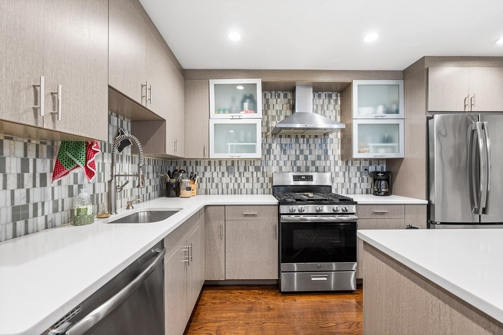 13 Ruthven Street, Unit 1 Boston, MA 02121 - Photo 8 of 35 a kitchen with a sink stove and refrigerator