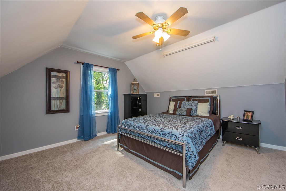 7224 Full Rack Drive Midlothian, VA 23112 - Photo 18 of 35 a spacious bedroom with a bed and a chandelier