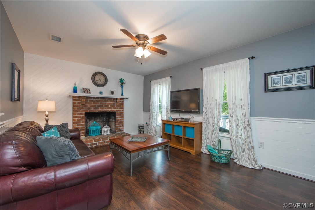 7224 Full Rack Drive Midlothian, VA 23112 - Photo 3 of 35 a living room with furniture a flat screen tv and a fireplace