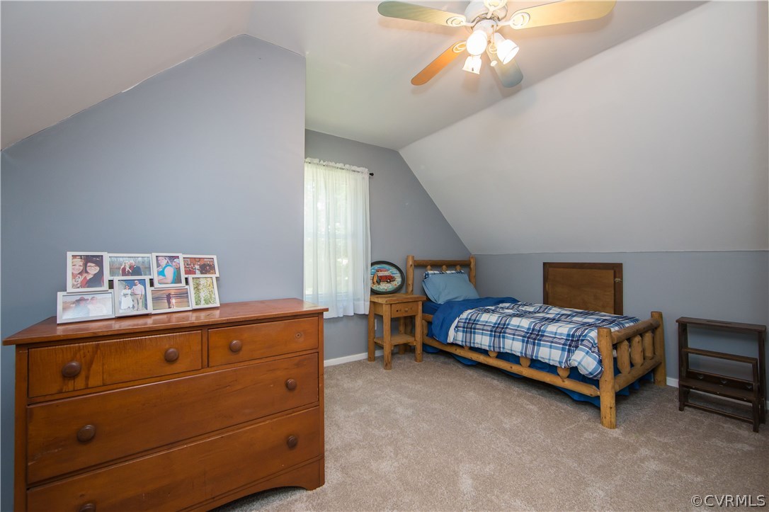 7224 Full Rack Drive Midlothian, VA 23112 - Photo 34 of 35 a bedroom with a bed and a chandelier