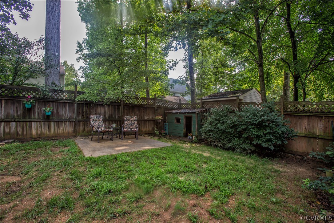 7224 Full Rack Drive Midlothian, VA 23112 - Photo 6 of 35 a view of backyard with sitting area and garden