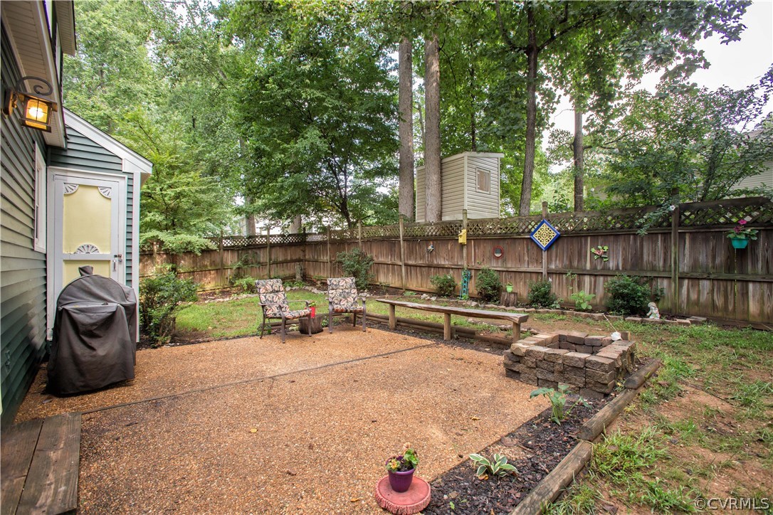 7224 Full Rack Drive Midlothian, VA 23112 - Photo 7 of 35 a view of a chair and tables in the back yard of the house