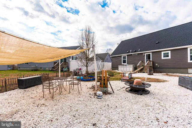 a view of a backyard with furniture