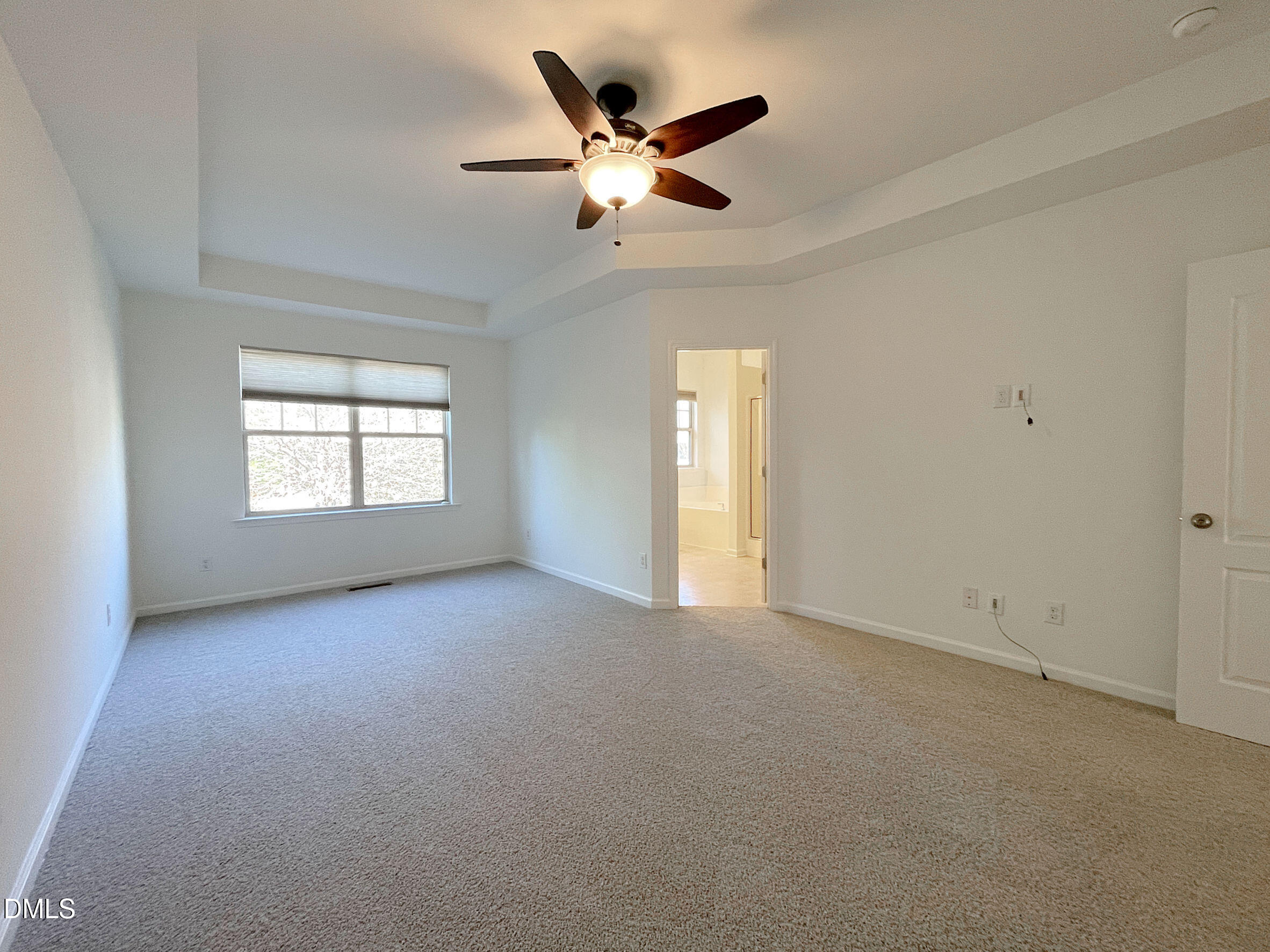 8257 Primanti Boulevard Raleigh, NC 27612 - Photo 15 of 27 an empty room with ceiling fan and windows