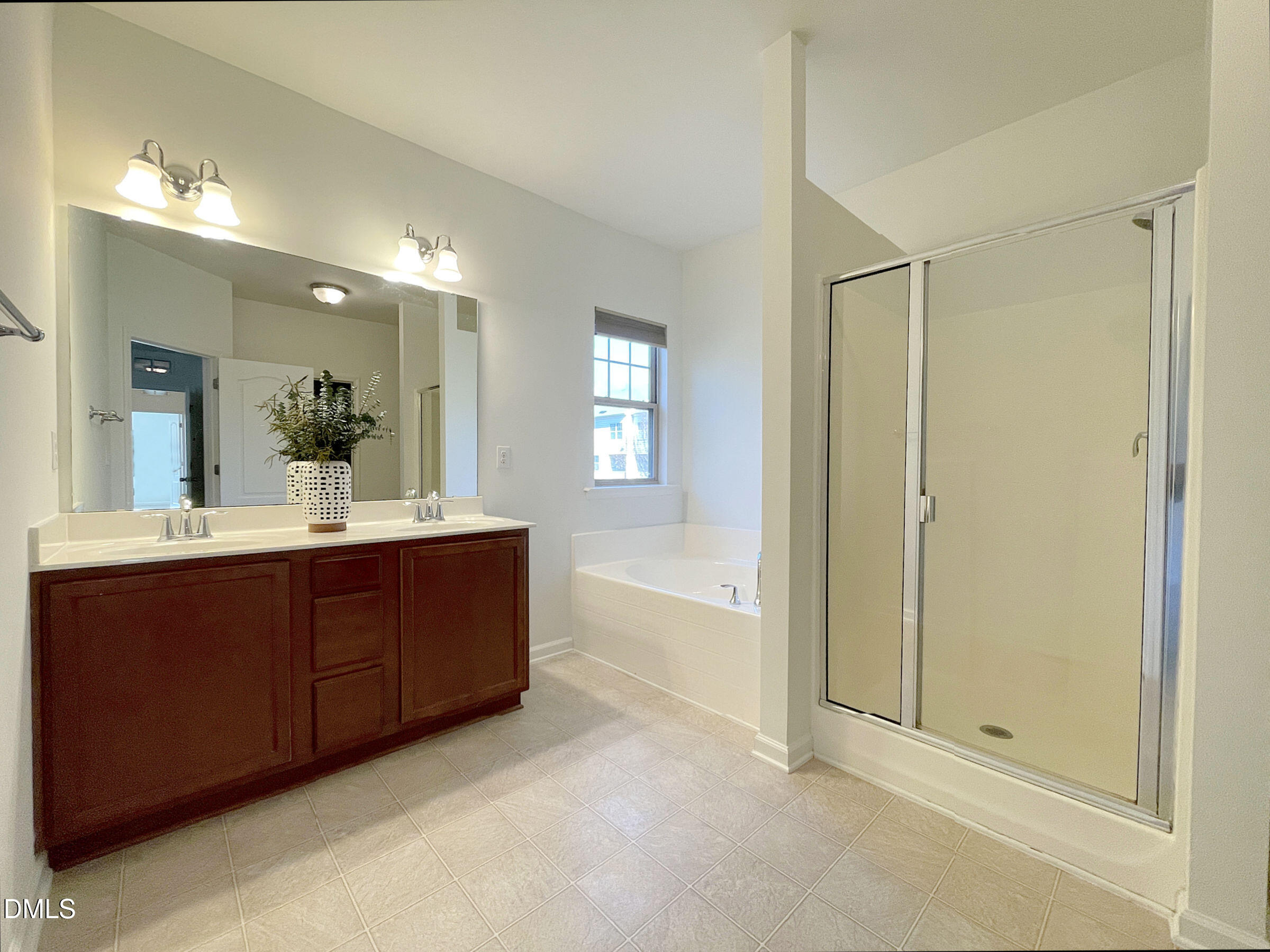 8257 Primanti Boulevard Raleigh, NC 27612 - Photo 16 of 27 a bathroom with a sink and a mirror