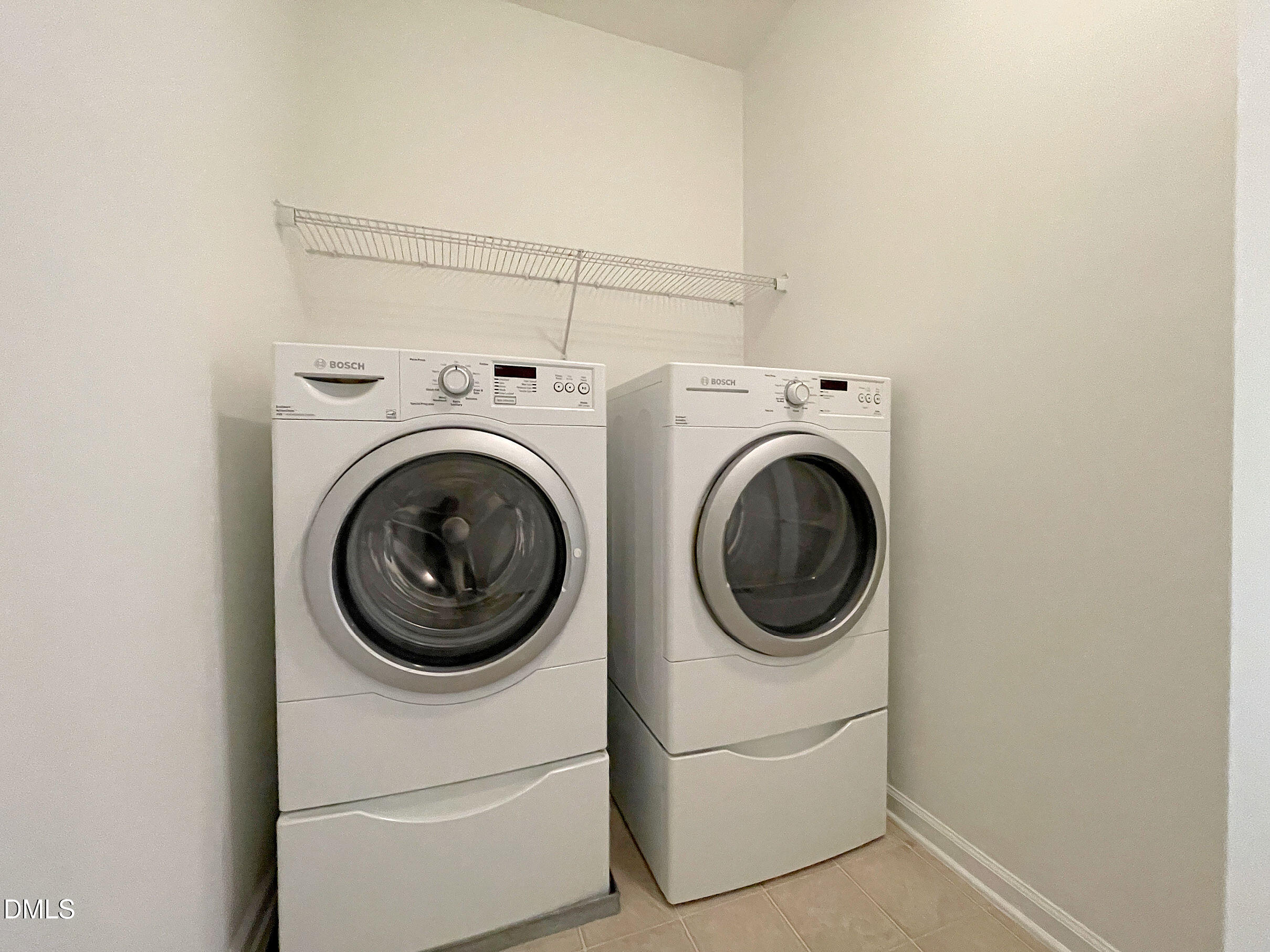 8257 Primanti Boulevard Raleigh, NC 27612 - Photo 21 of 27 a utility room with dryer and washer