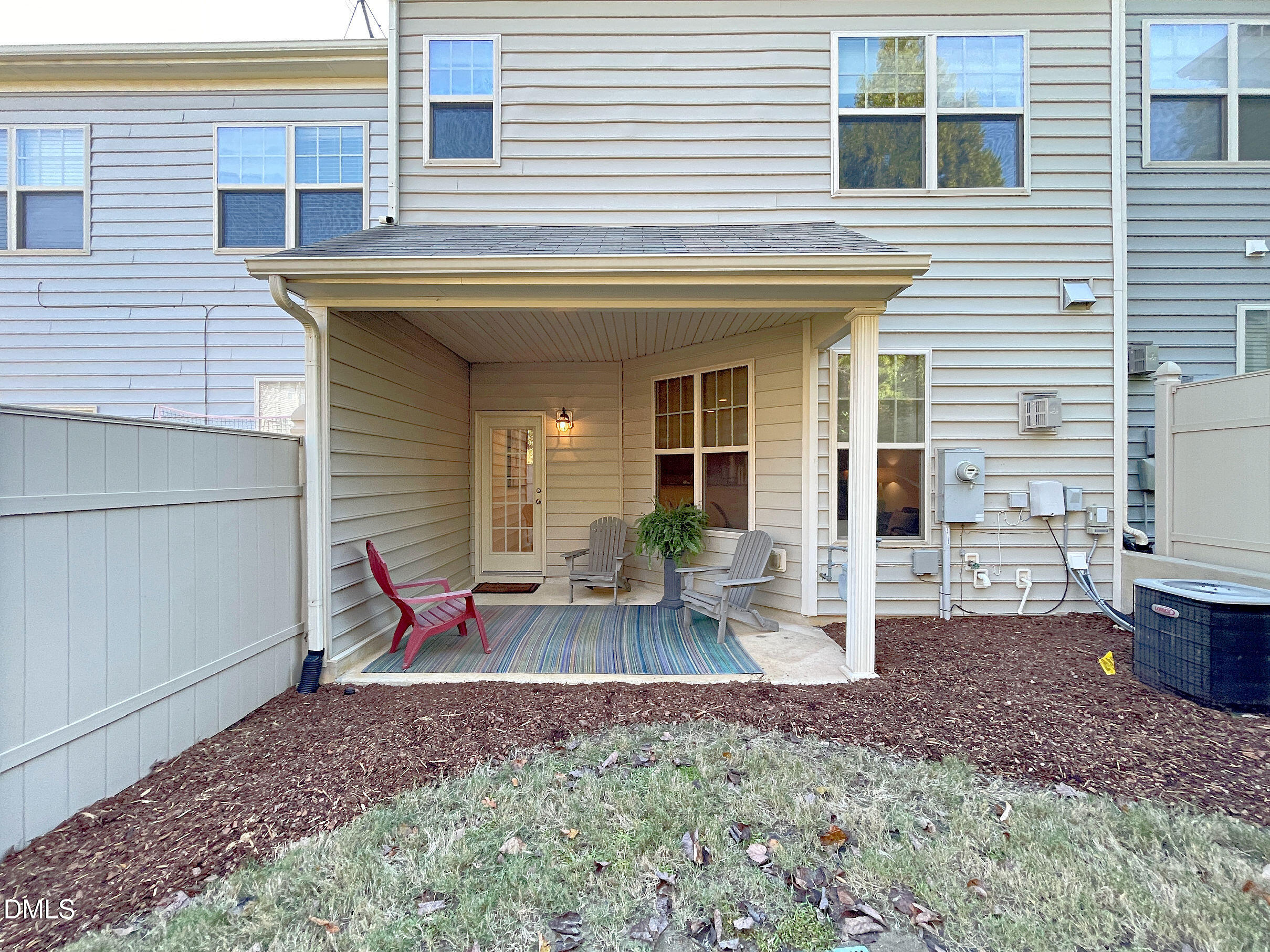 8257 Primanti Boulevard Raleigh, NC 27612 - Photo 24 of 27 a view of a house with backyard and chairs