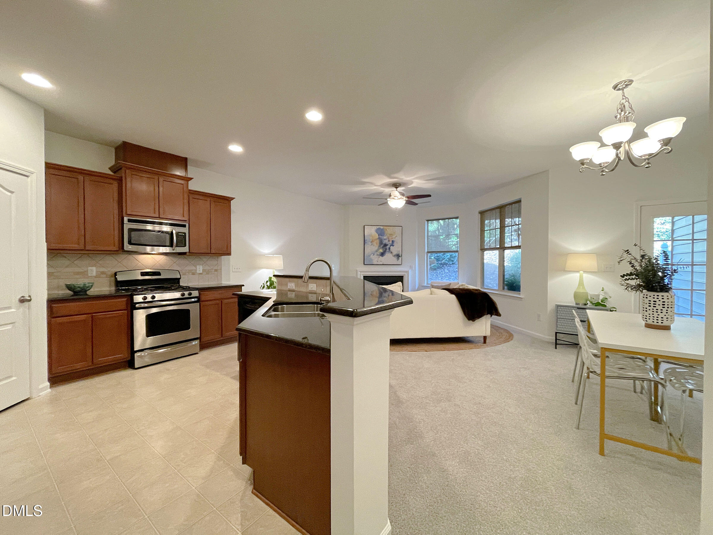 8257 Primanti Boulevard Raleigh, NC 27612 - Photo 10 of 27 a kitchen with stove a sink and refrigerator