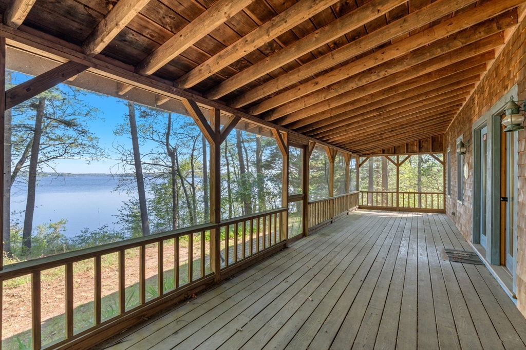 a view of porch with wooden floor