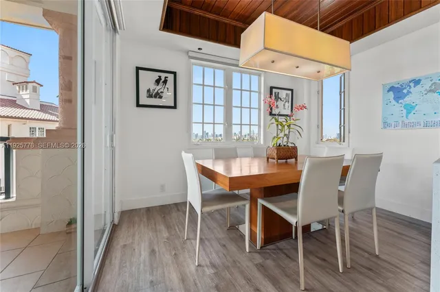 a living room with furniture a table and chairs