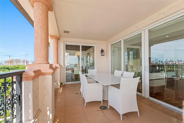a view of a hallway with workspace and stairs