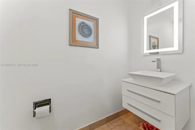 a living room with furniture and a mirror