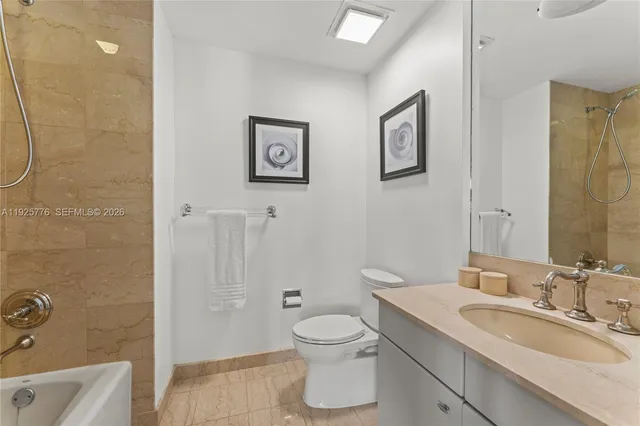 a living room with furniture a wooden floor and next to a window