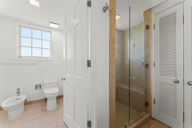 a view of a lake with a table and chair