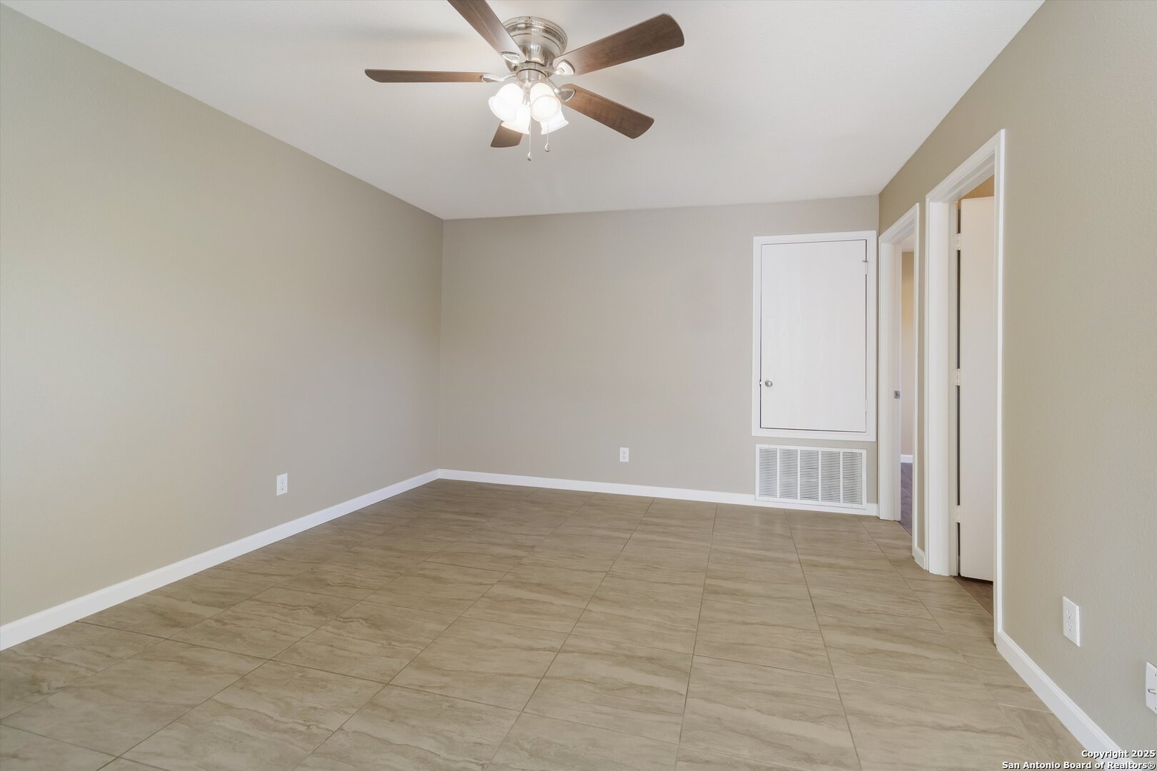 25002 Orchard Acres San Antonio, TX 78261 - Photo 21 of 29 an empty room with closet and a chandelier fan