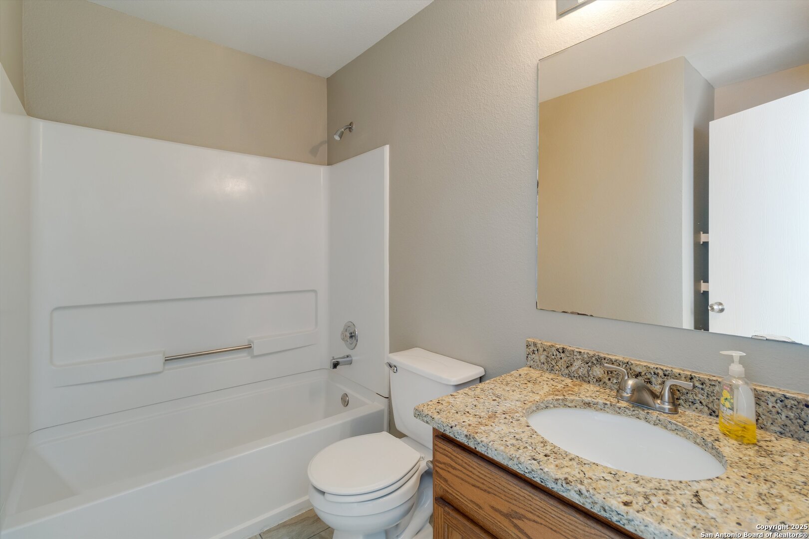 25002 Orchard Acres San Antonio, TX 78261 - Photo 25 of 29 a bathroom with a granite countertop sink toilet and shower