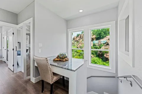 a workspace with furniture and window