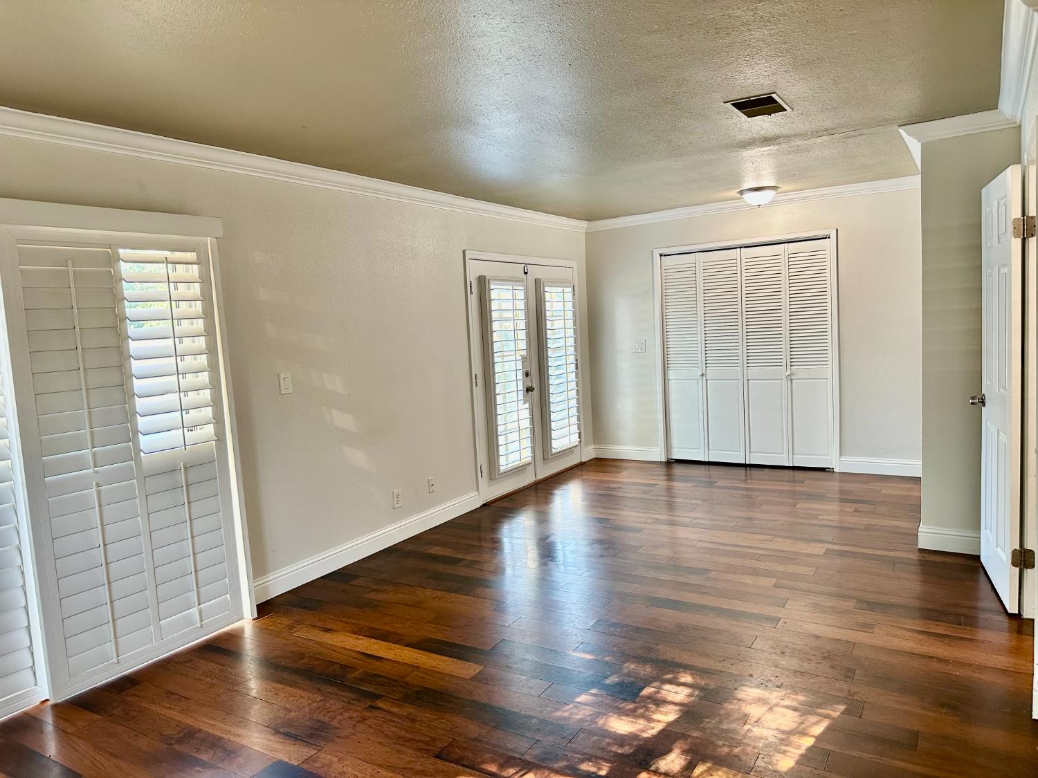 5683 North Rafael Avenue Fresno, CA 93711 - Photo 11 of 19 a view of empty room with wooden floor and fan