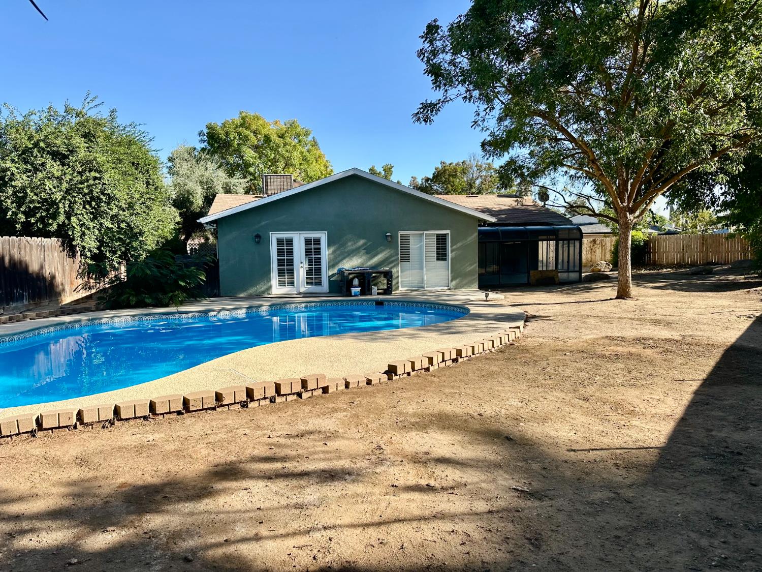 5683 North Rafael Avenue Fresno, CA 93711 - Photo 15 of 19 a view of the house with a yard