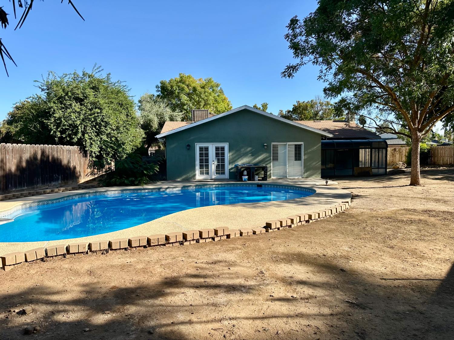 5683 North Rafael Avenue Fresno, CA 93711 - Photo 16 of 19 a view of a house with a yard