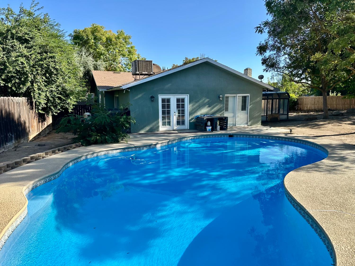 5683 North Rafael Avenue Fresno, CA 93711 - Photo 17 of 19 a front view of house with yard nad seating space