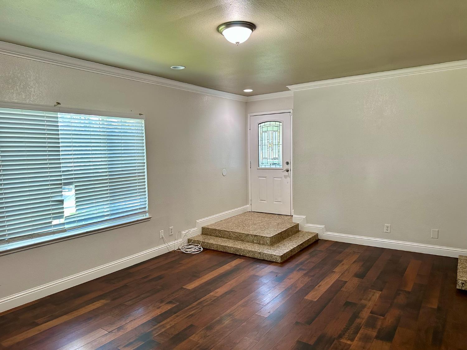 5683 North Rafael Avenue Fresno, CA 93711 - Photo 3 of 19 a living room with hard wood floors and a window
