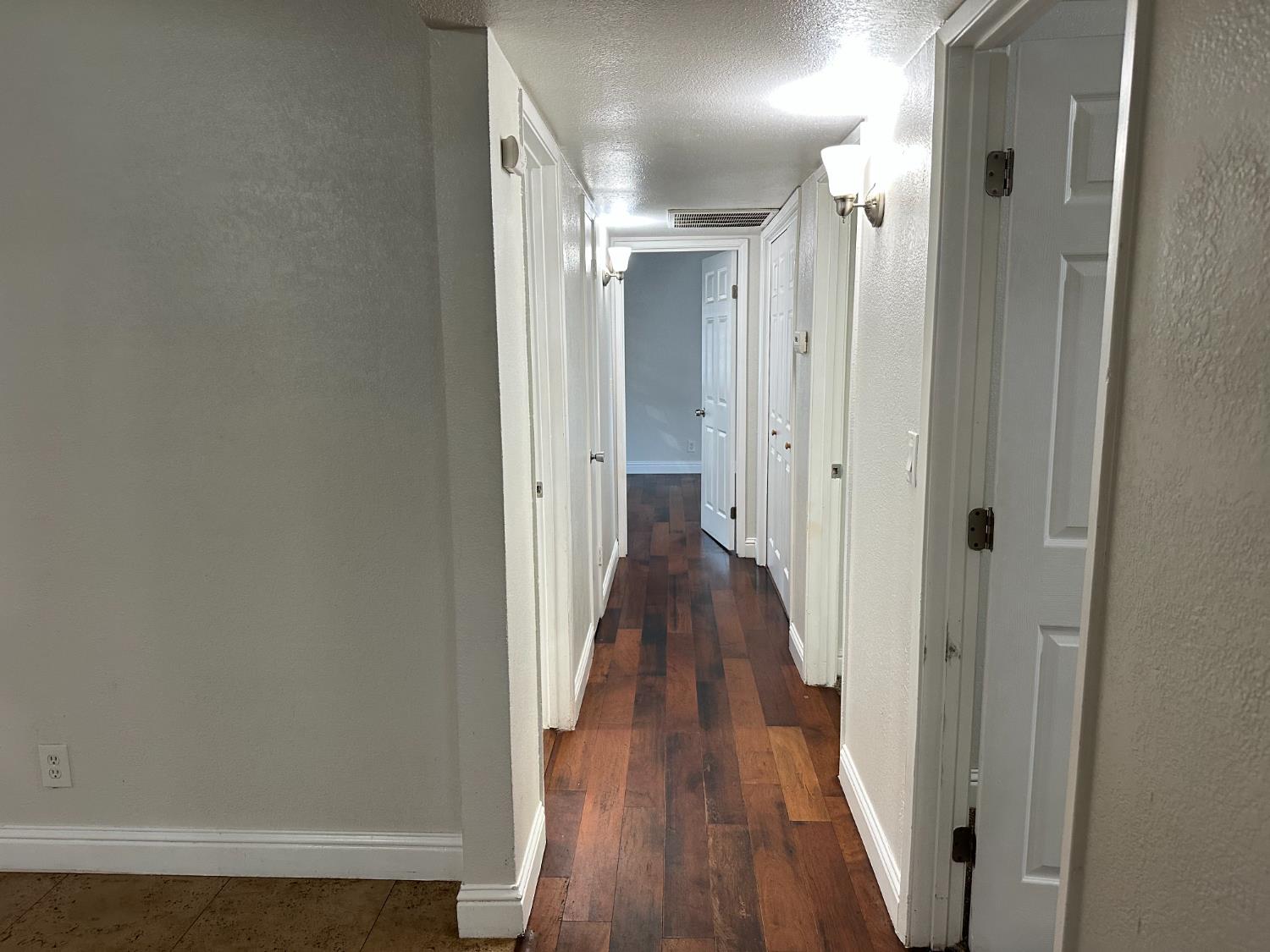 5683 North Rafael Avenue Fresno, CA 93711 - Photo 5 of 19 a view of a hallway with wooden floor and staircase