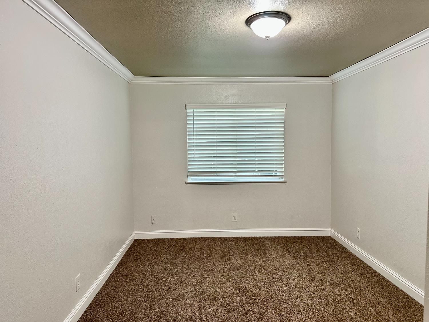5683 North Rafael Avenue Fresno, CA 93711 - Photo 9 of 19 an empty room with a window