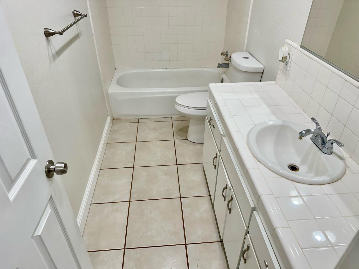 5683 North Rafael Avenue Fresno, CA 93711 - Photo 10 of 19 a bathroom with a sink a toilet and shower