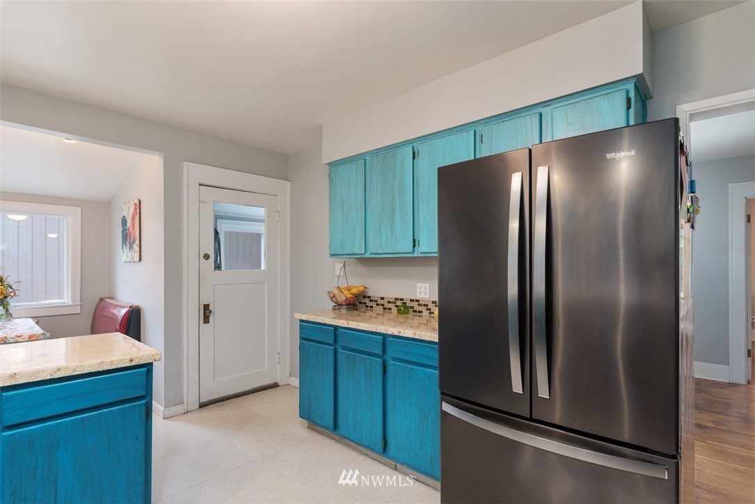 2959 Main Street Custer, WA 98240 - Photo 13 of 33 a kitchen with stainless steel appliances granite countertop a refrigerator and a sink