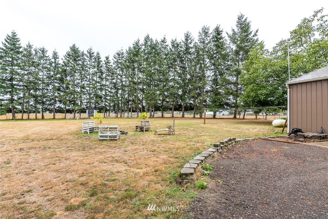 2959 Main Street Custer, WA 98240 - Photo 29 of 33 a view of a swimming pool with a yard and trees