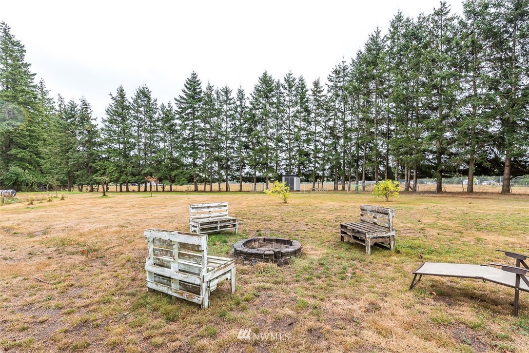 2959 Main Street Custer, WA 98240 - Photo 30 of 33 a view of a lake with chairs and wooden bench