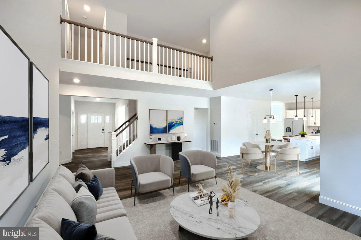 910 Freemansville Road Reading, PA 19607 - Photo 8 of 38 a living room with furniture and a large mirror with wooden floor