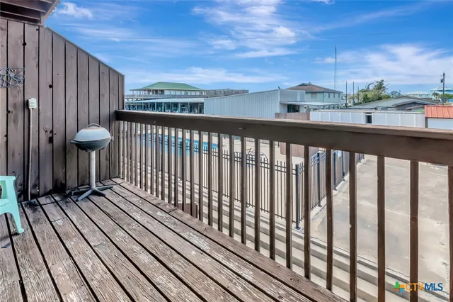 a view of balcony with wooden floor