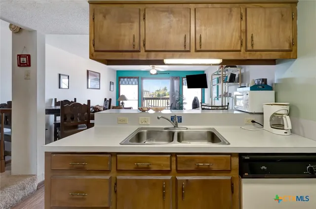 a kitchen with a sink and cabinets