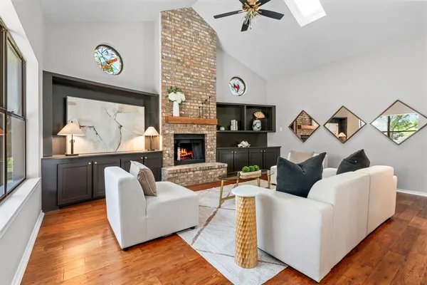 a living room with furniture and a fireplace