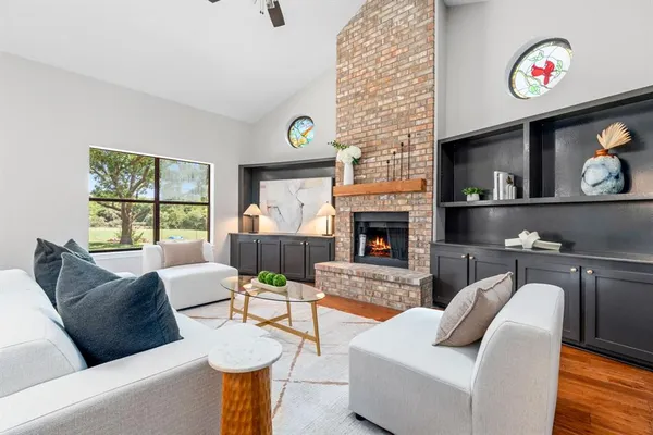 a living room with furniture and a fireplace