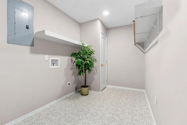 an empty room with potted plants