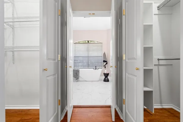 a bathroom with a tub and shower